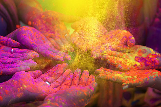 Hands of indian people during holi celebration in India
